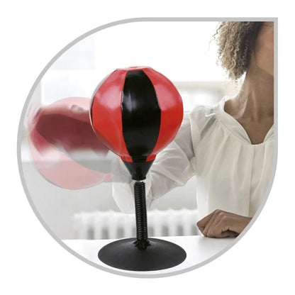 Table punching ball with red and black ball on a black weighted base and stand