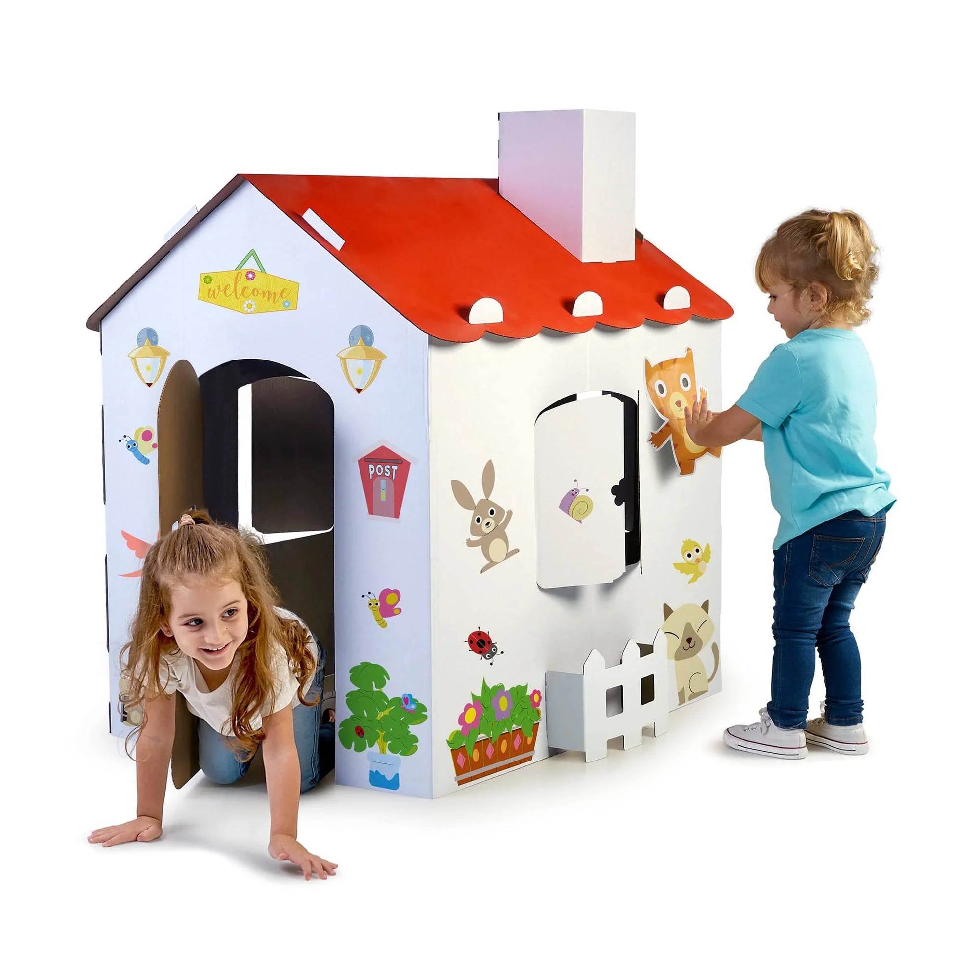 Carton House playhouse with red roof and animal decals; child playing at entrance