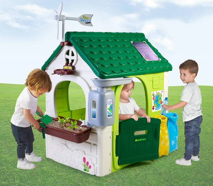 Playhouse Eco House with open green door, front garden planter and solar roof panel