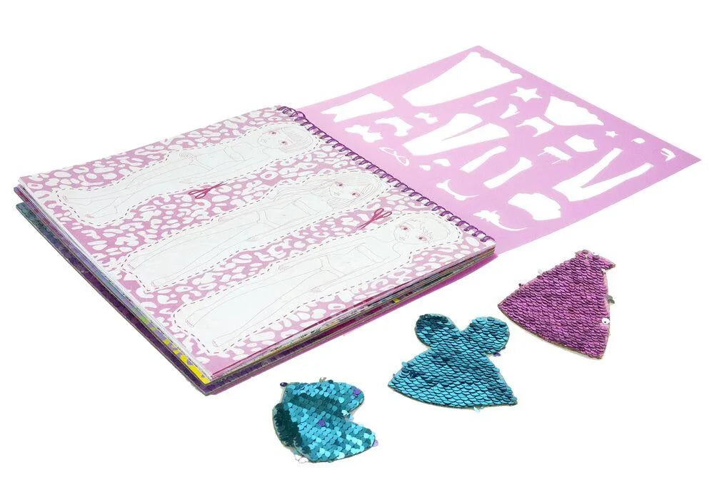 Fashion sketch book open to patterned pages, with three glitter tail-shaped stickers