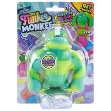 Squishy monkey toy in blister pack, green and yellow stretchable figure