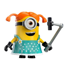 Carl the Streamer Minion figure with orange hair, goggles, teal polka-dot dress, mic.
