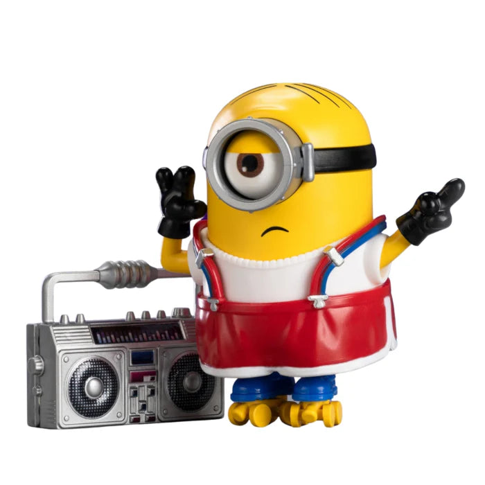 Stuart Minion figure wearing goggles and red overalls, hands up, with radio