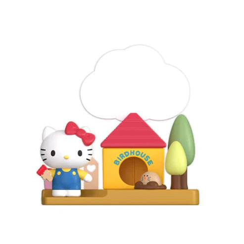 Hello Kitty at birdhouse with red roof and green leaves on tan base