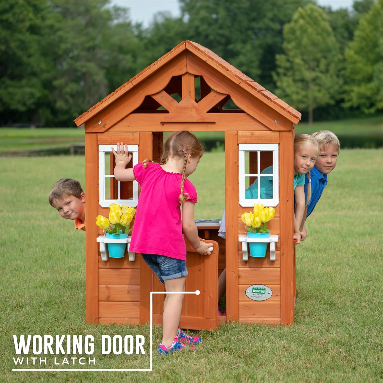 Working door with latch on cedar playhouse front