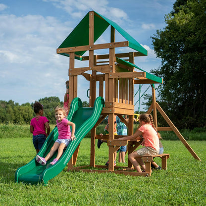 Outdoor cedar swing set playhouse with green slide and rope swings