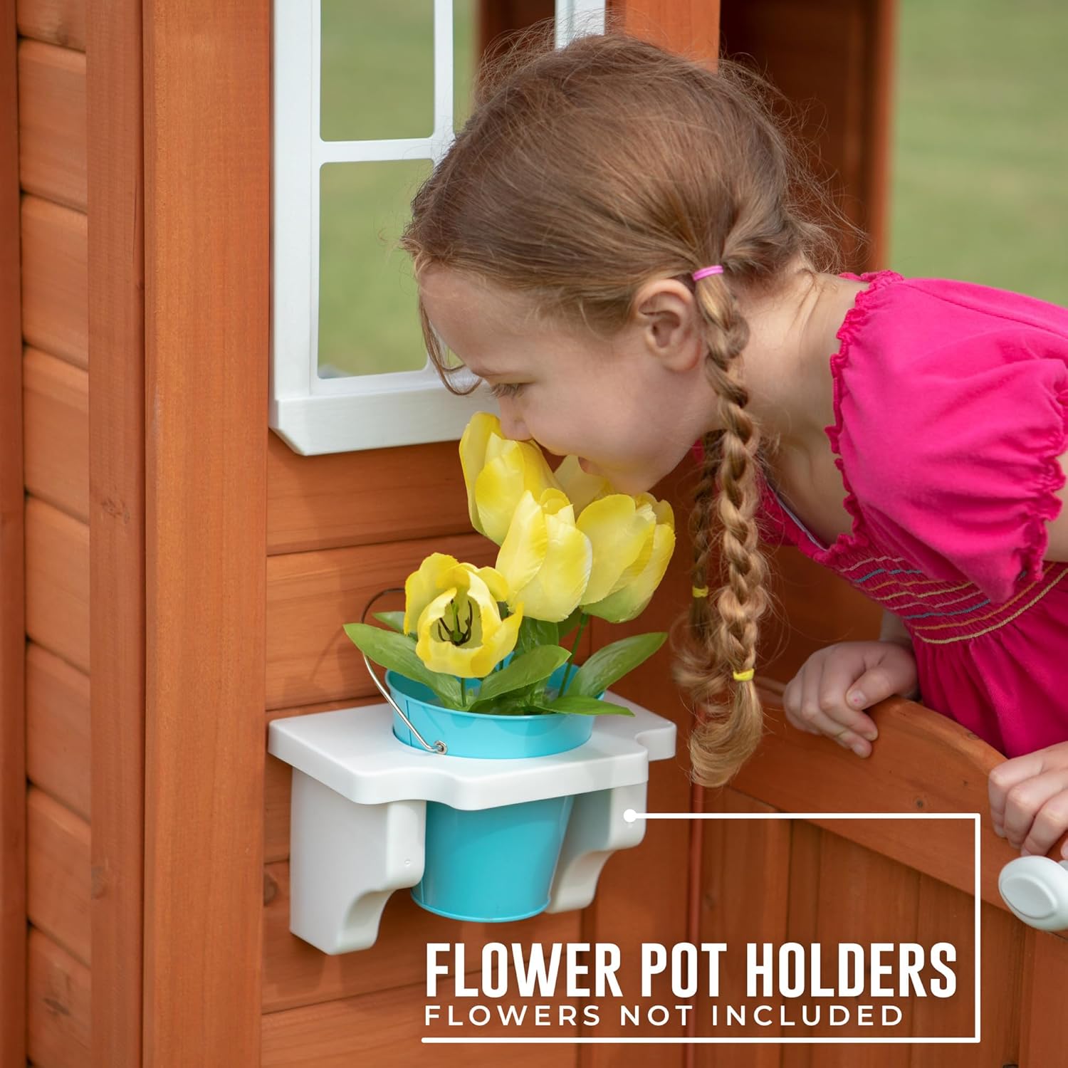 Flower pot holder on side shelf inside cedar playhouse