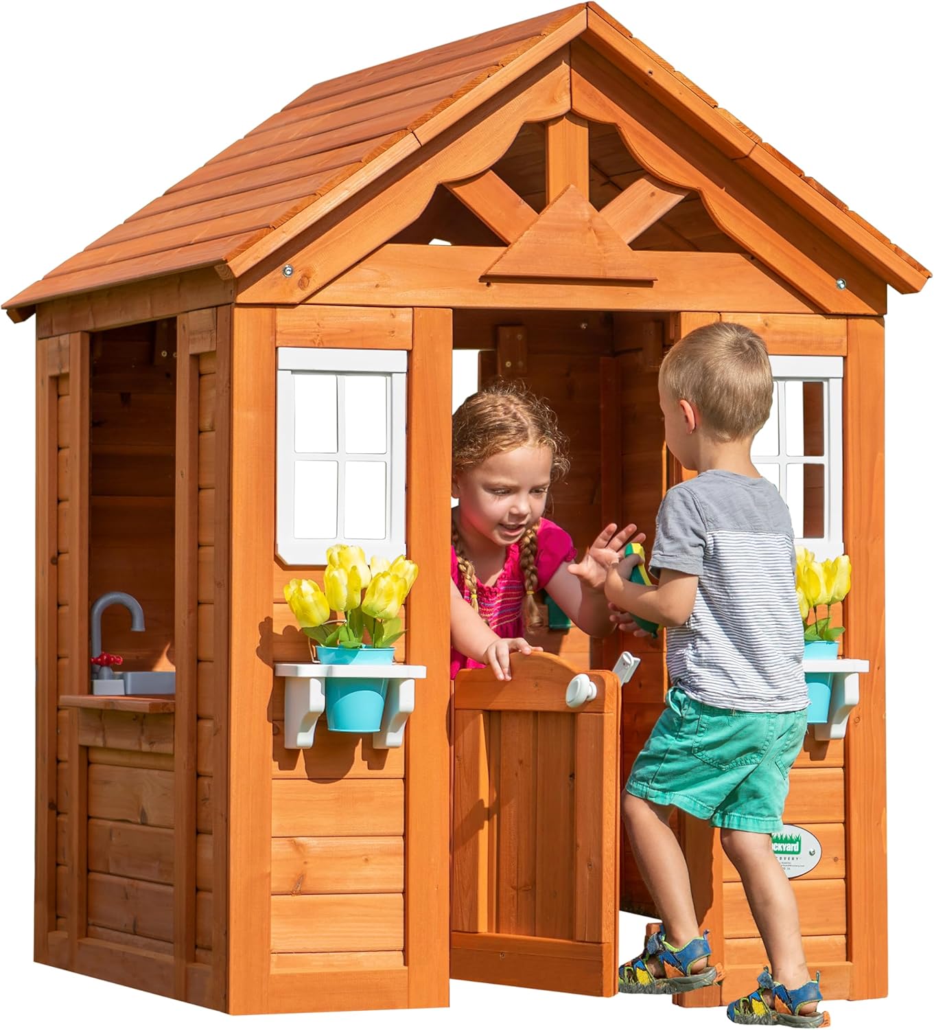 Cedarwood playhouse with gabled roof, front windows, and open doorway