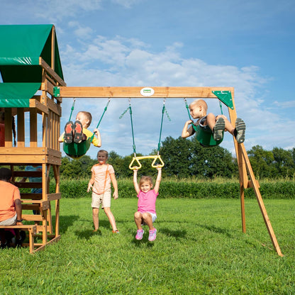 Cedar playset swing beam with two green bucket seats and climbing tower