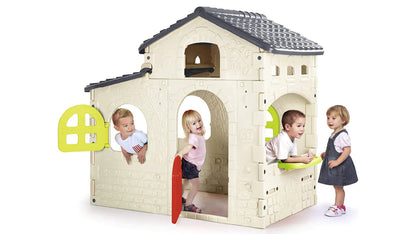 Kids playhouse with white walls, dark roof, arched doors, and green side panels