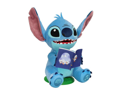 Peluche Stitch interactivo azul con libro abierto y orejas rosas