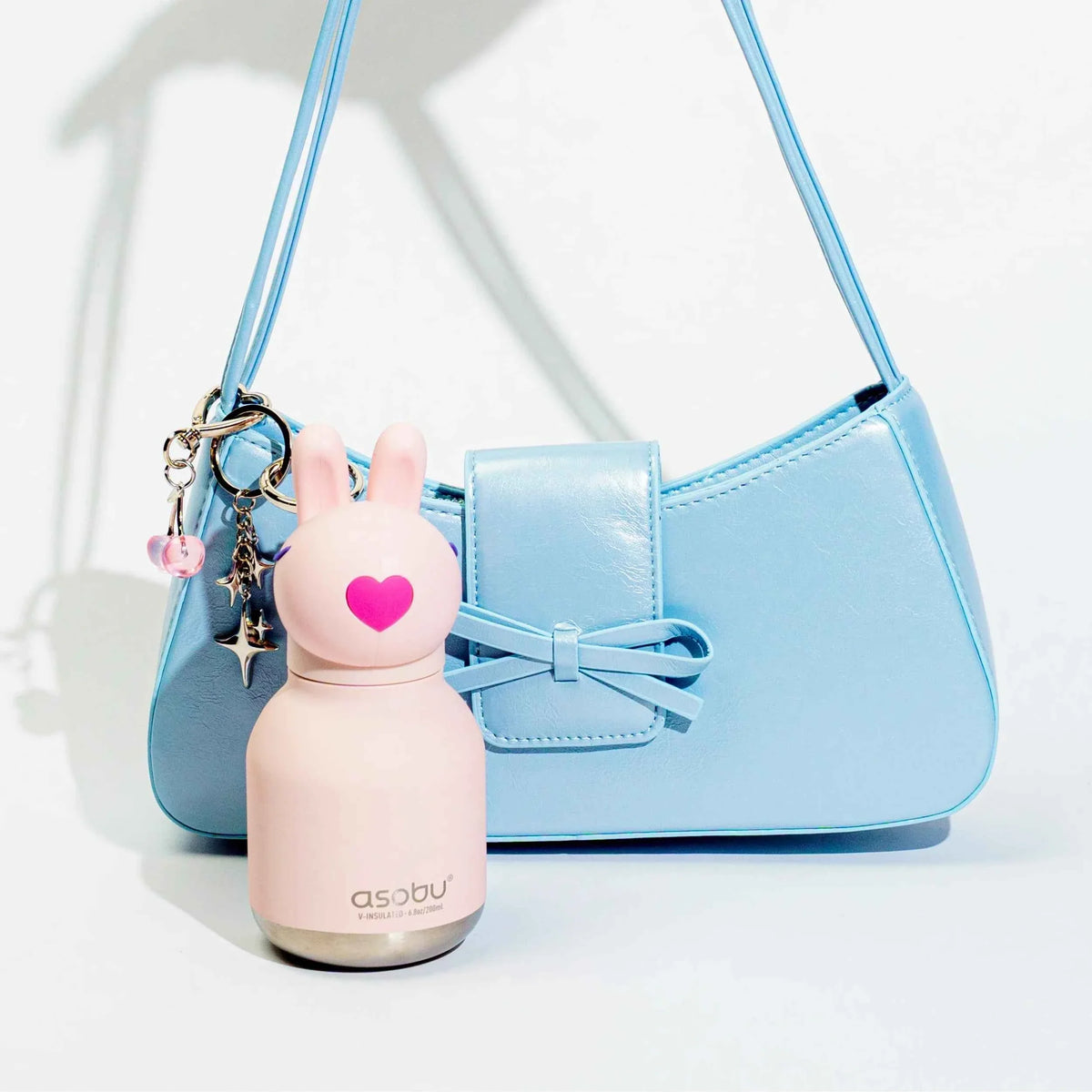 Light blue bunny mini water bottle keychain with pink heart detail