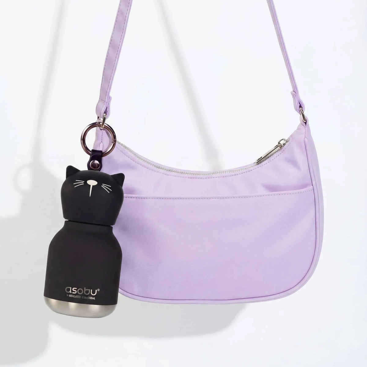 Mini animal water bottle keychain with black cat face on light purple crossbody strap.