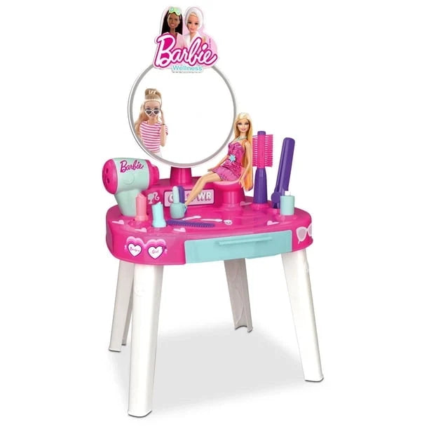 Pink beauty vanity table with round mirror, doll, and grooming accessories