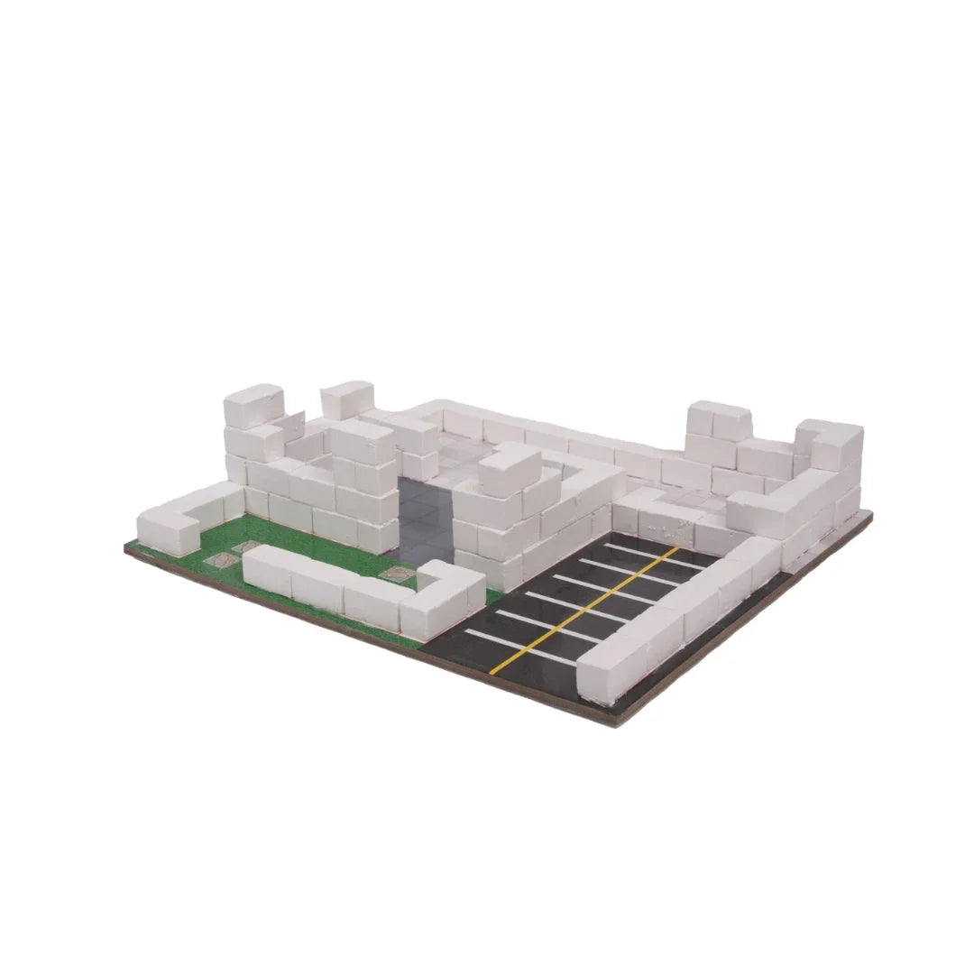 Police station model on baseplate with light gray walls, green yard, and black driveway stripes