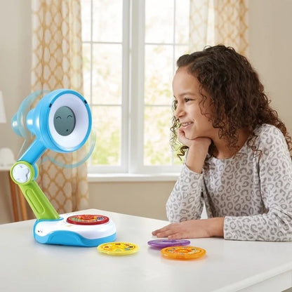 Blue interactive toy on table with character screen and colorful learning discs