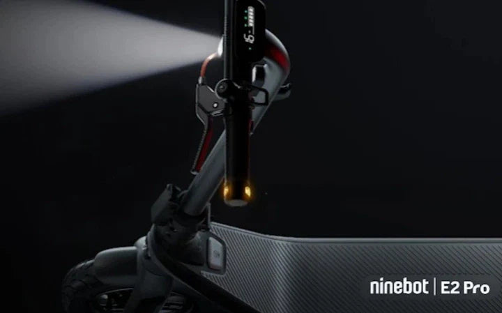Ninebot E2 Pro electric scooter front with illuminated light near handlebars