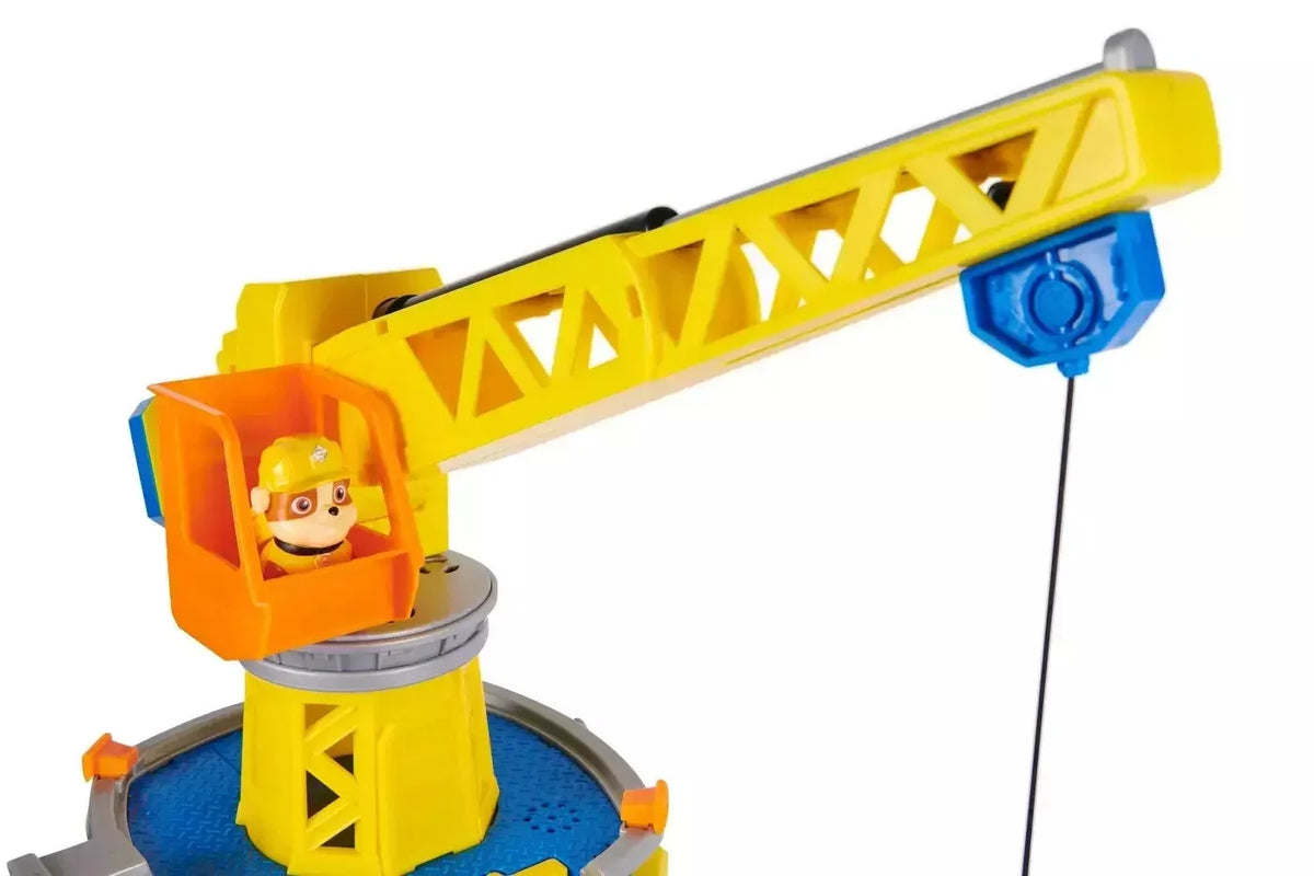 Close-up yellow crane arm with orange cab and blue pulley, black cable