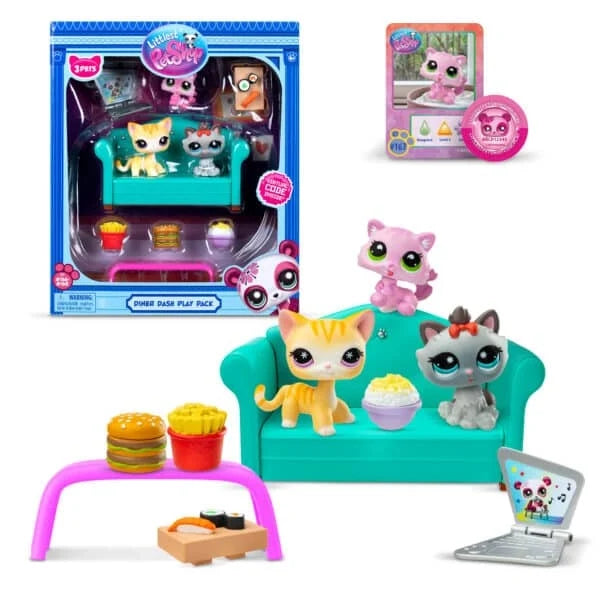 Diner Dash play set in box with animal figures, laptop, and food accessories on teal sofa