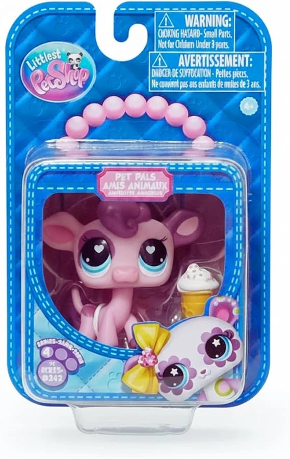 Pink pet surprise toy figure in blue blister package, large heart eyes