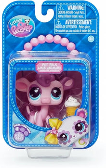 Pink pet surprise toy figure in blue blister package, large heart eyes