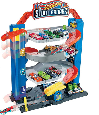 Hot Wheels Stunt Garage playset with orange and blue ramps and multiple toy cars