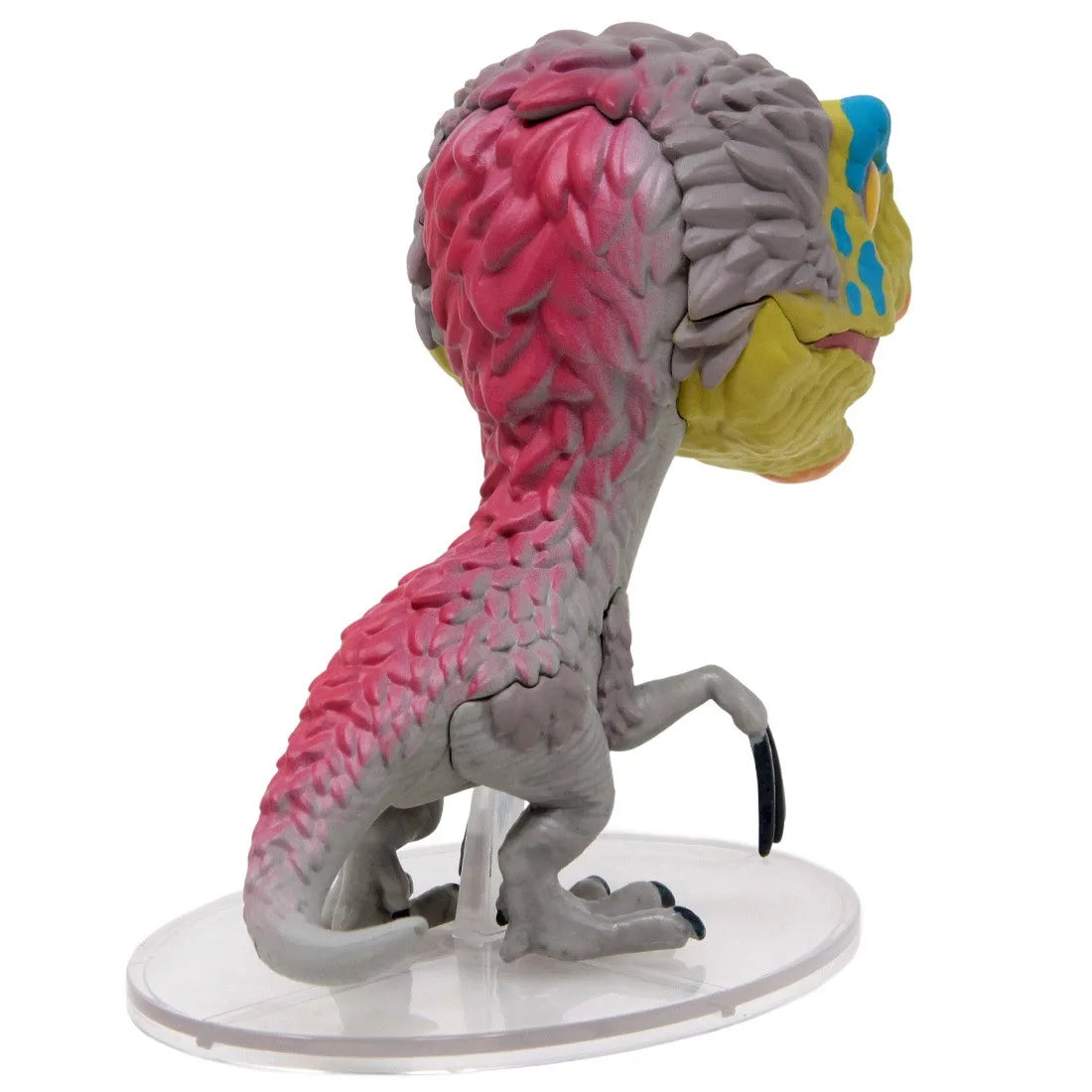 Therizinosaurus dinosaur figurine, pink and gray body with yellow face crest, on base