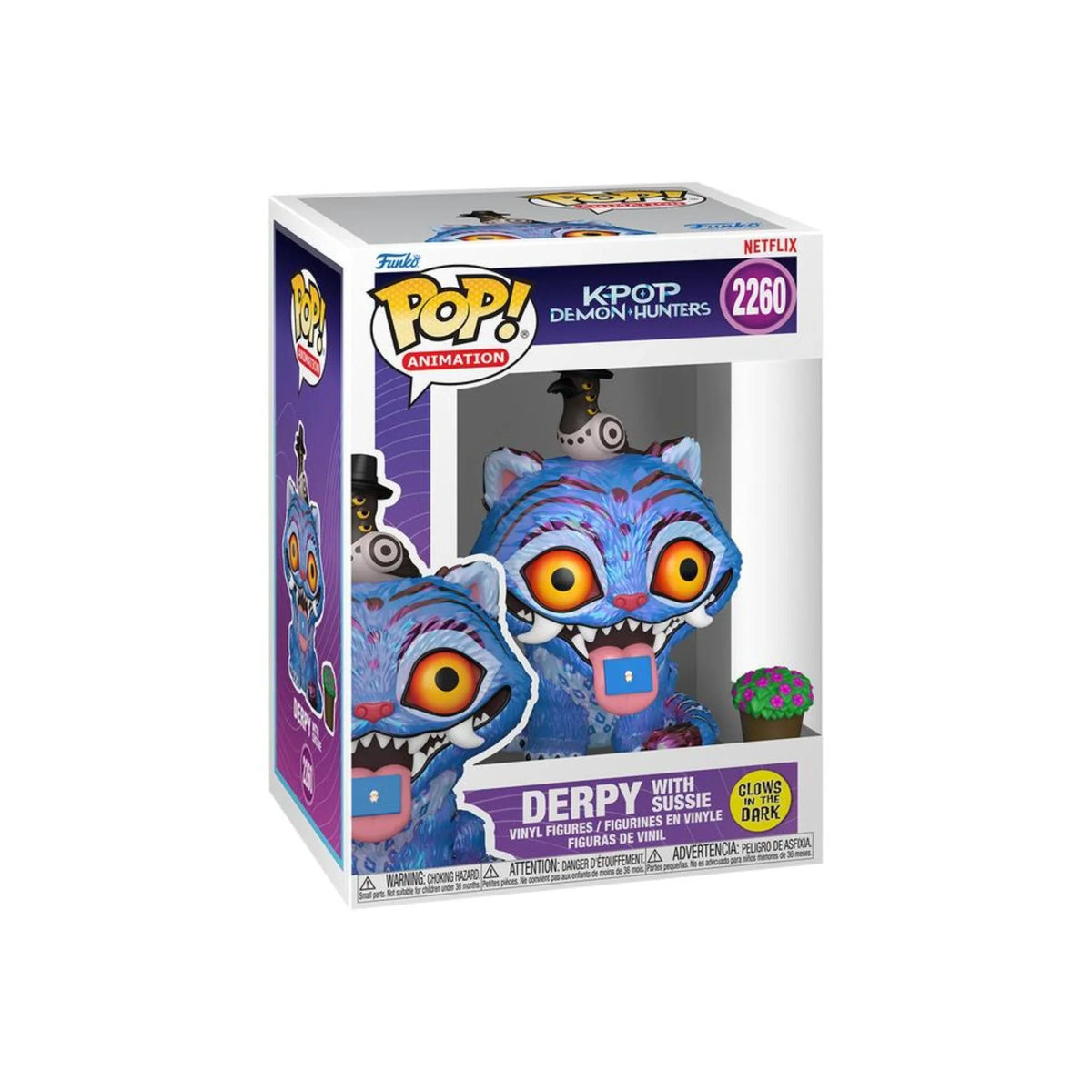 Glow vinyl collectible figure in box, blue creature with orange eyes and open mouth