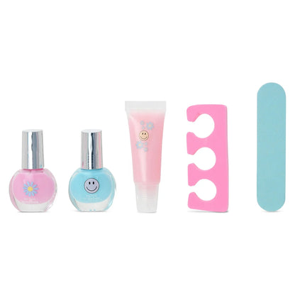 Smile-themed beauty set with nail polish bottles, pink tube, and nail file