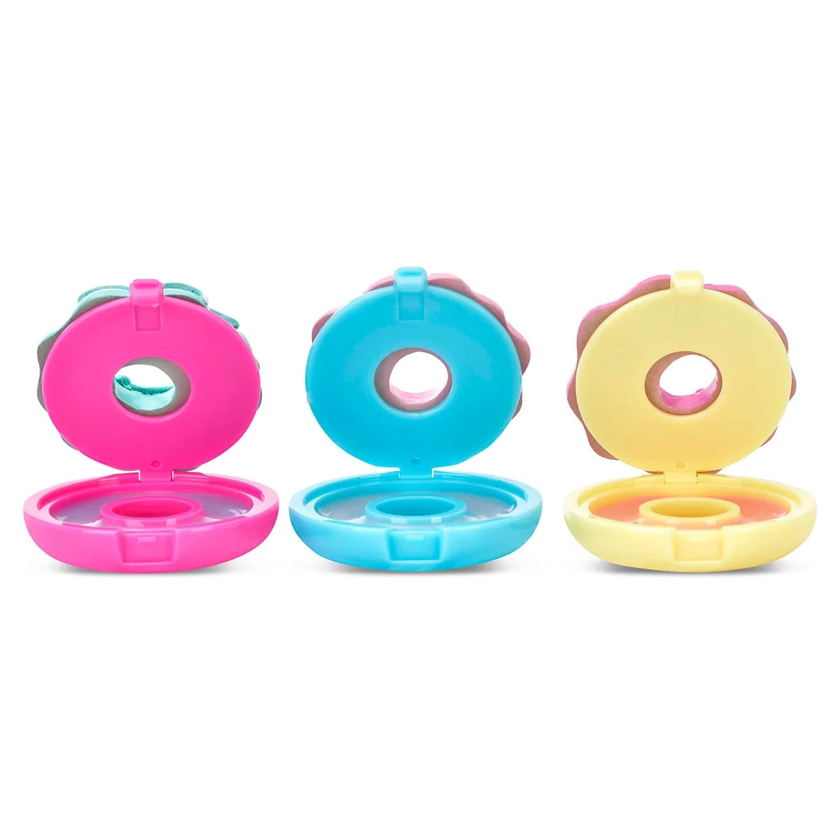 Donut-shaped lip balm set: open pink, blue, yellow containers with visible balm