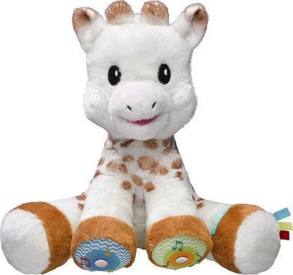 White and brown plush giraffe toy with sensory feet and fabric tag