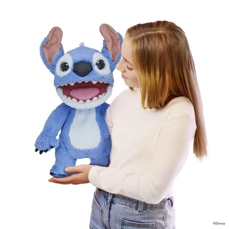 Blue Stitch plush puppet with large ears and open mouth, held by a child