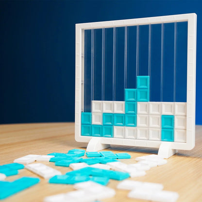 White tabletop grid board with blue and white tile pieces