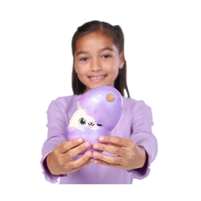 Purple mamacorn surprise toy with horn, held by a child