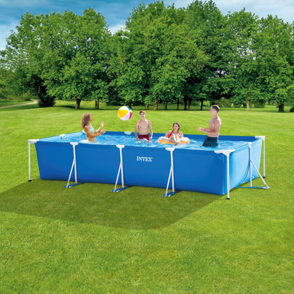 Rectangular above-ground pool with blue liner and metal frame in a backyard