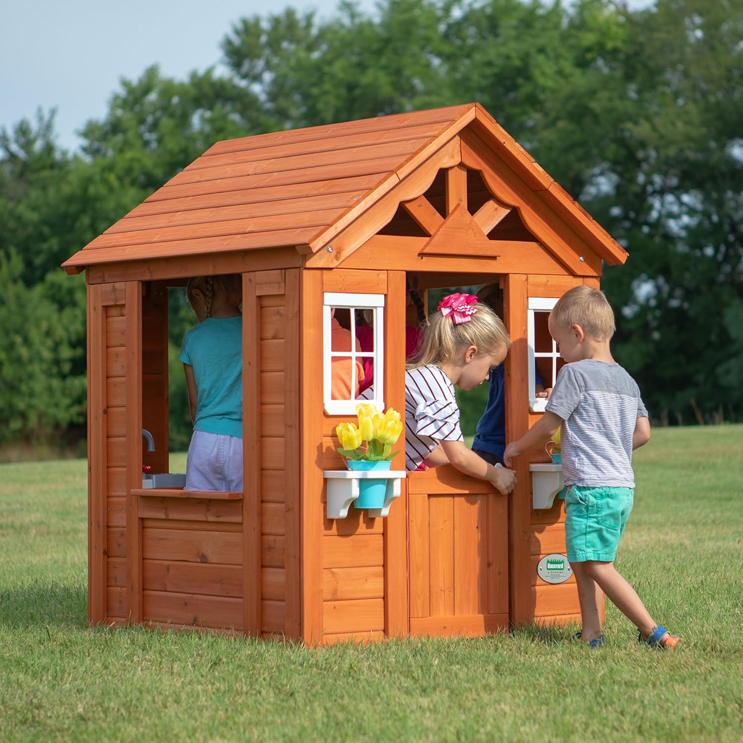 Cedar playhouse exterior with left window opening and front snack window shelf