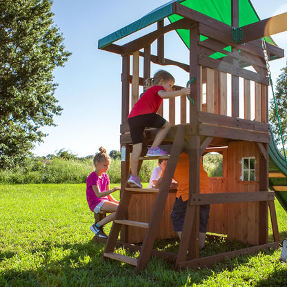 Wood playhouse tower with ladder and green canopy, kids climbing and playing