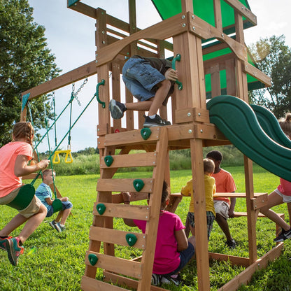 Cedar wood play tower with ladder, green swing seats, and curved slide