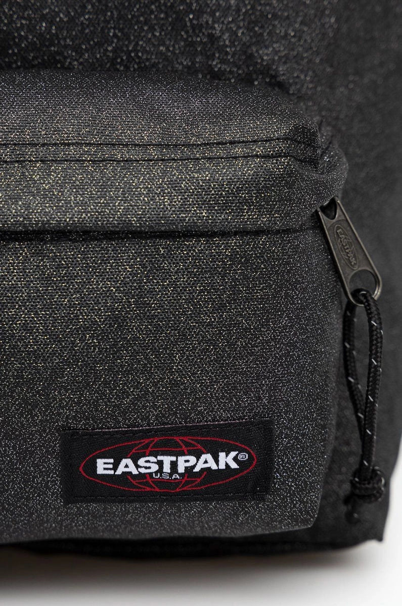 Black textured backpack side panel with Eastpak logo patch and zipper pull