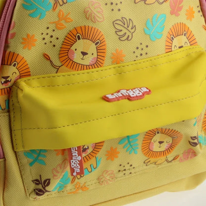 Kids mini backpack front pocket close-up, yellow panel with Smiggle logo