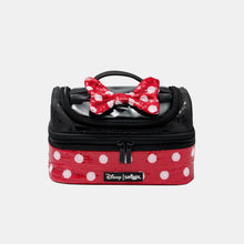 Red polka-dot lunch bag with black top, bow detail, and front zipper pouch