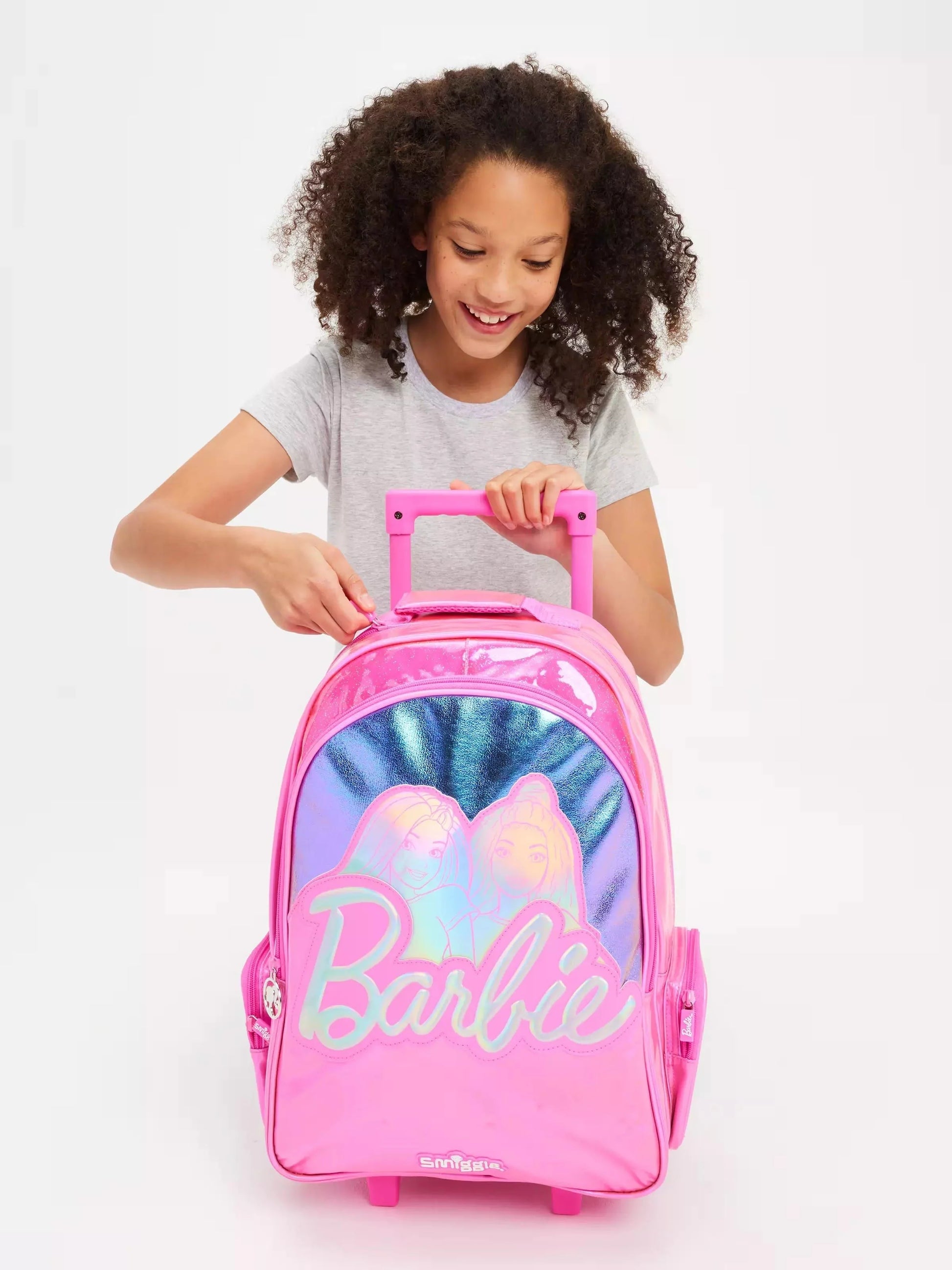 Pink Smiggle trolley backpack with Barbie logo and upright handle, small wheels