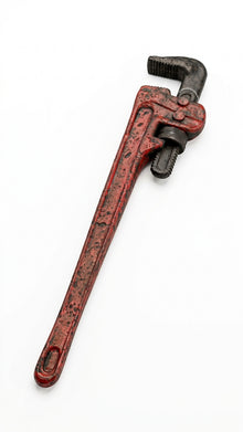 Red plastic novelty wrench with faux blood splatter