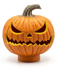 Orange carved jack-o'-lantern pumpkin with grinning face cutouts and gray stem