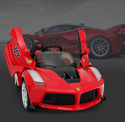 Kids ride-on sports car in red with black grille, open scissor-style doors