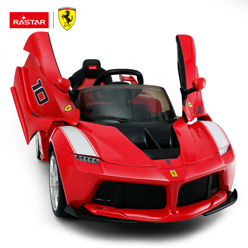 Kids ride-on sports car in red with black interior, open scissor-style doors