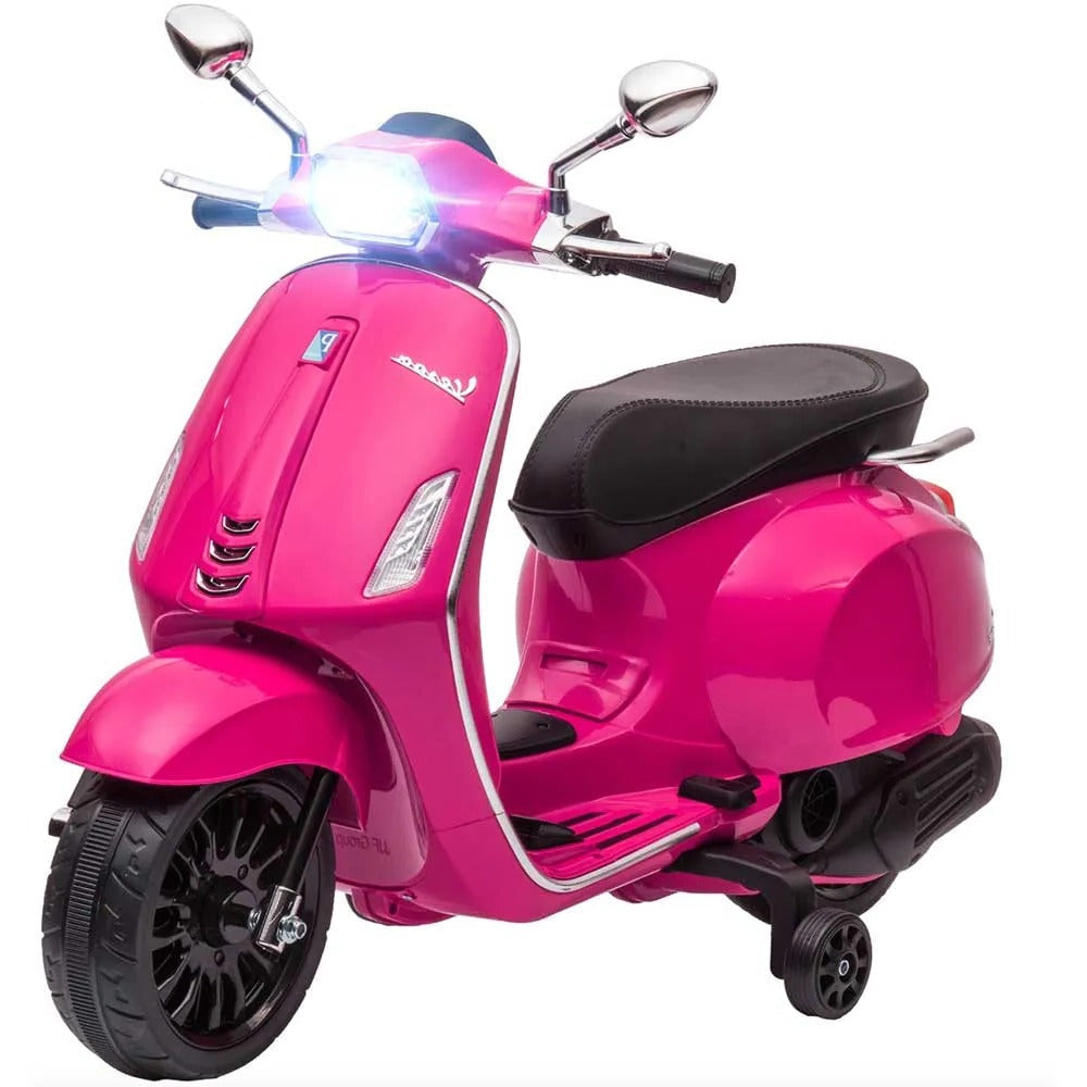 Big Vespa 6V pink scooter with black seat, chrome mirrors, and front and rear wheels