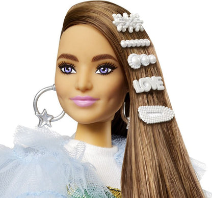 Close-up of blue tulle doll face and long brown hair with white star and heart clips
