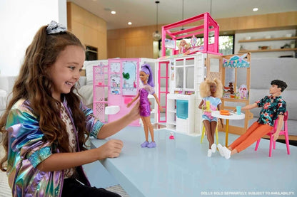 Dollhouse playset with pink-and-white doors, bed and kitchen area; dolls with puppy