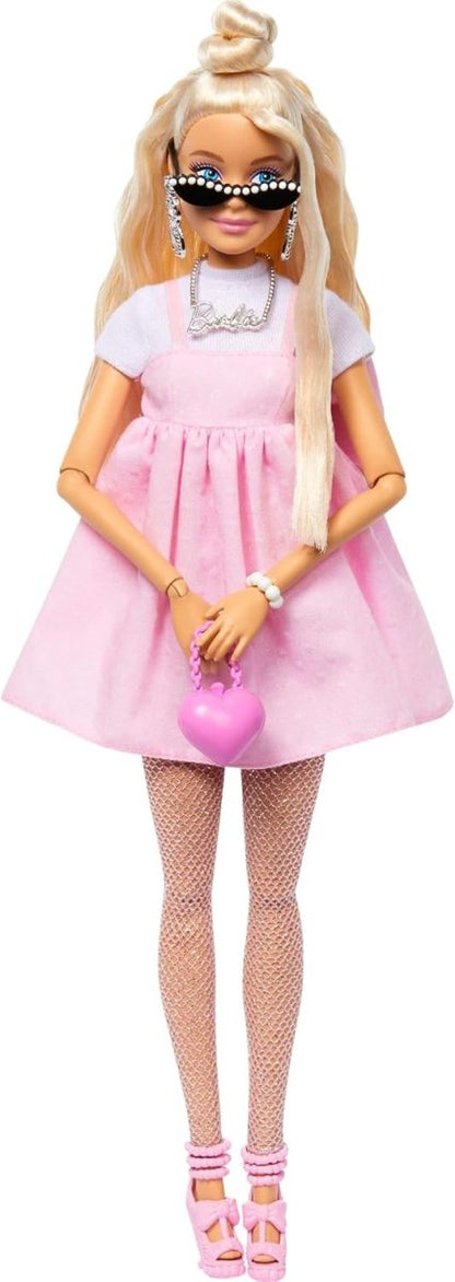 Fashionistas Doll with blonde hair, pink dress, white top, striped leggings and purple shoes